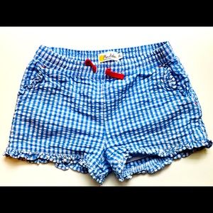 Mini Boden blue gingham shorts with pockets.
